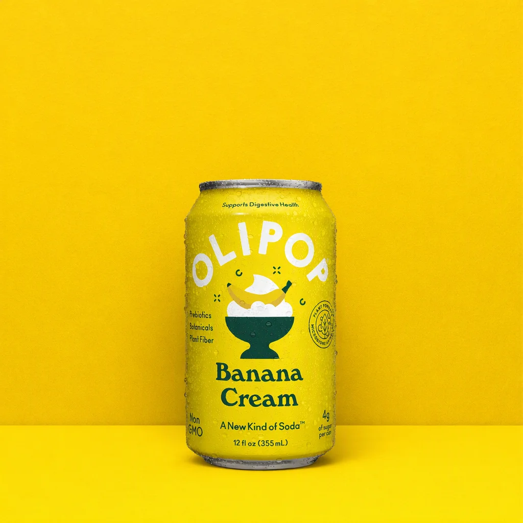 The OLIPOP can against two flat bands of yellow, a lighter wall over a deeper floor